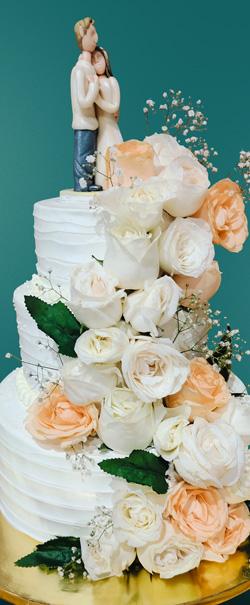 Elegant white wedding cake with flowers