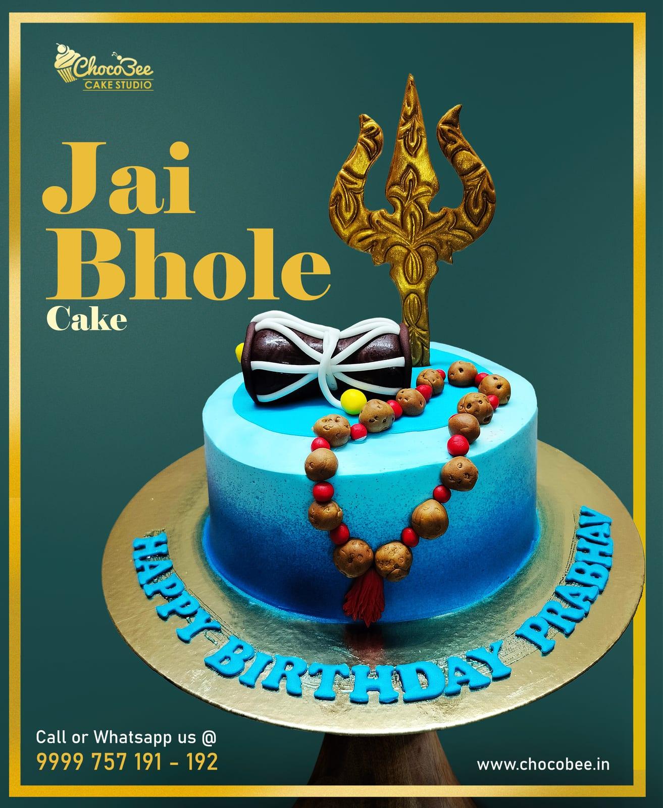 Blue Lord Shiva themed cake with a golden trishool, damru and rudraksha mala for Prabhav by Chocobee Cake Studio